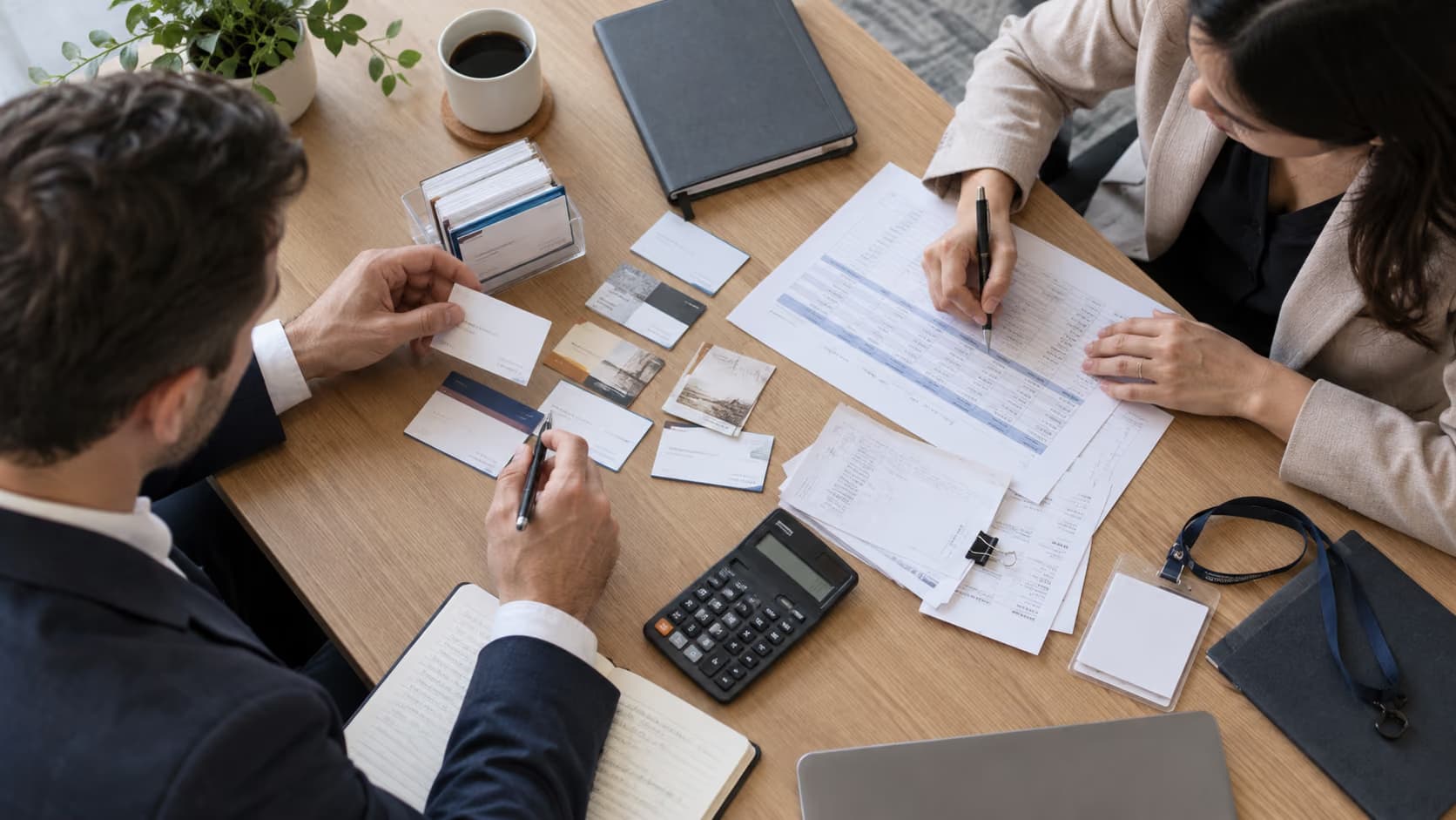 Sales team comparing trade show lead records and financial results